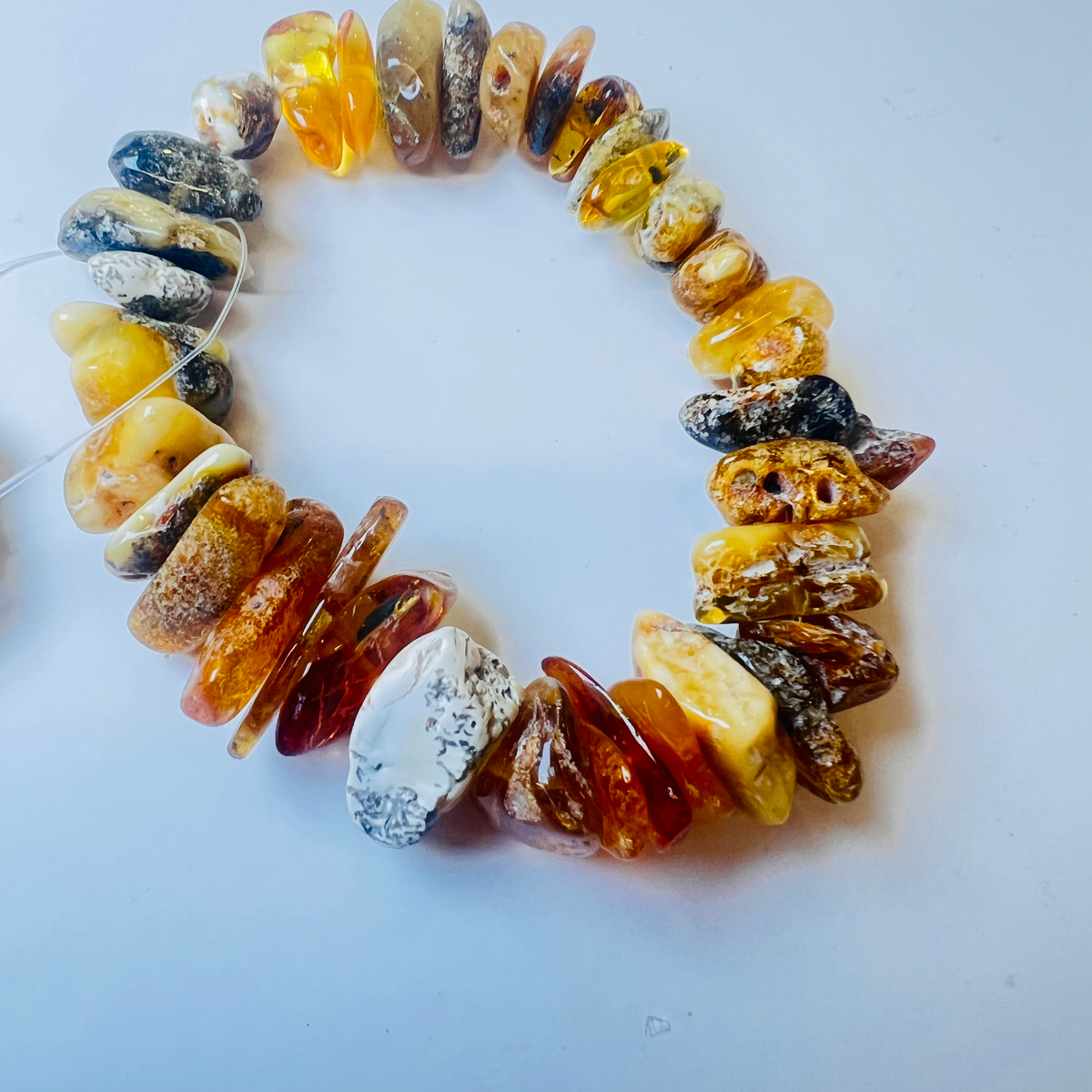 Original camera photograph of KIZIMA 3N0200q20.40 amber jewelry on its real background