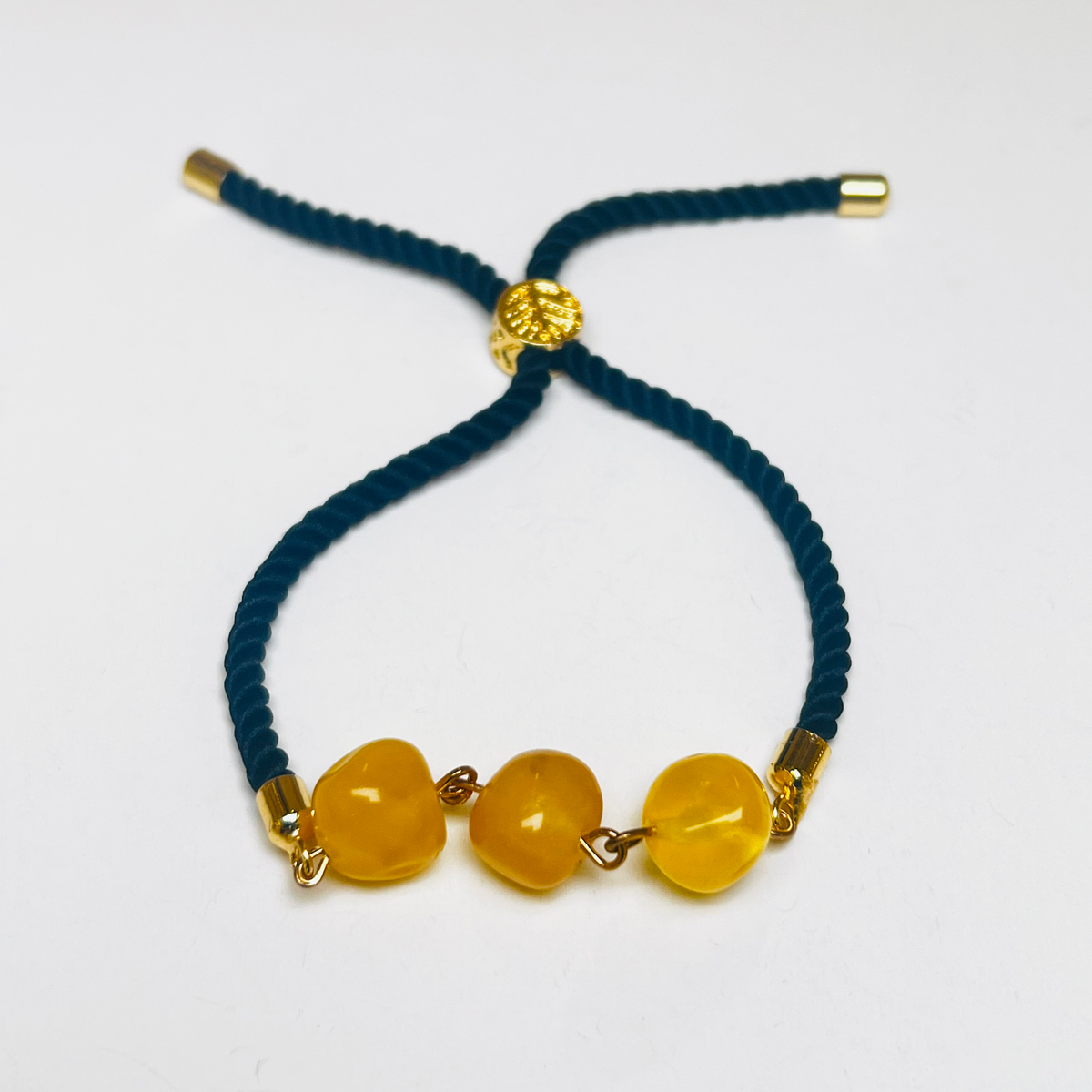 Original camera photograph of KIZIMA 3P0500q5.73 amber jewelry on its real background