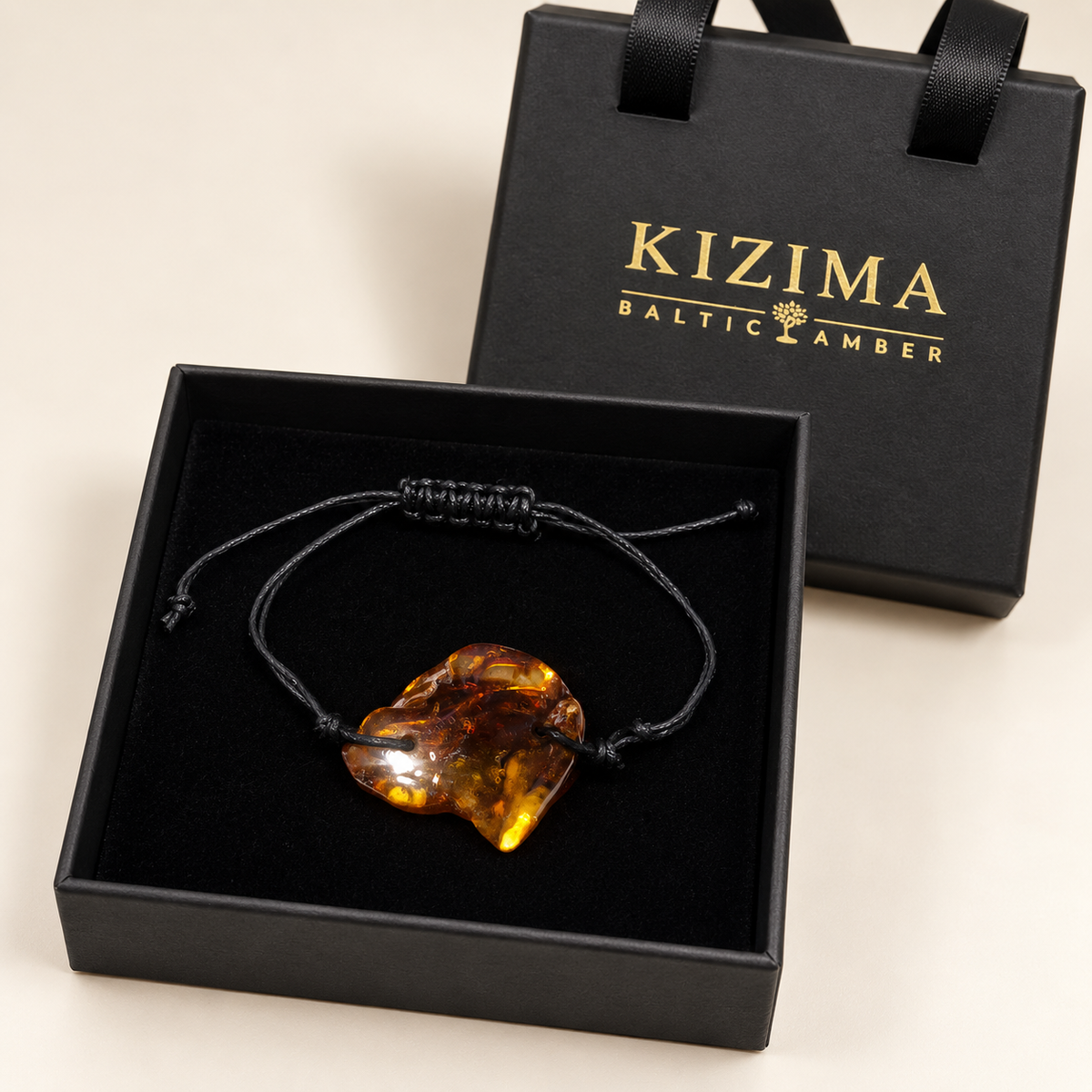KIZIMA 3G0100q2.32 cognac amber cord bracelet in its black branded gift box