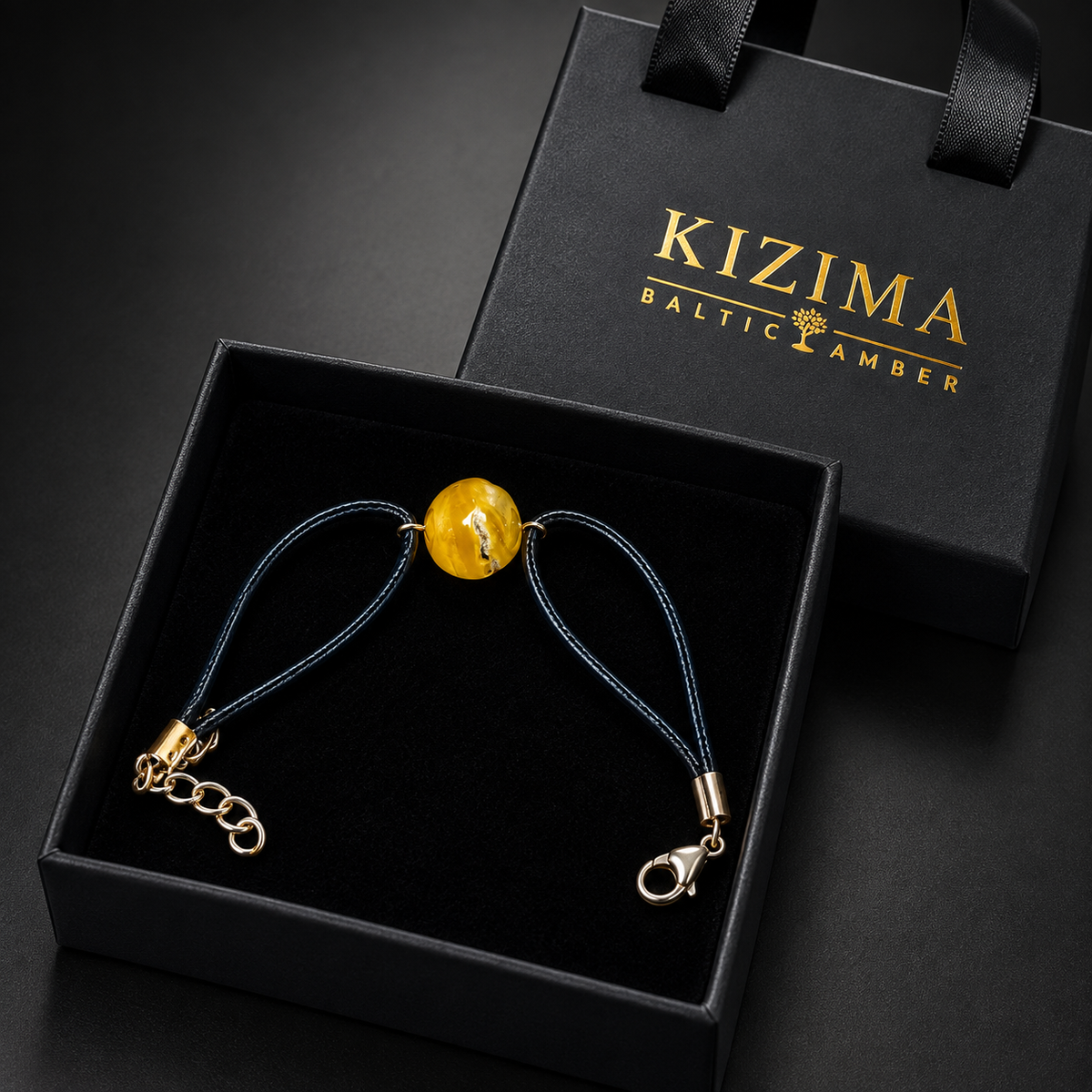KIZIMA 3G0100q3.47 yellow amber single-stone bracelet on dark navy cord in the KIZIMA black velvet gift box