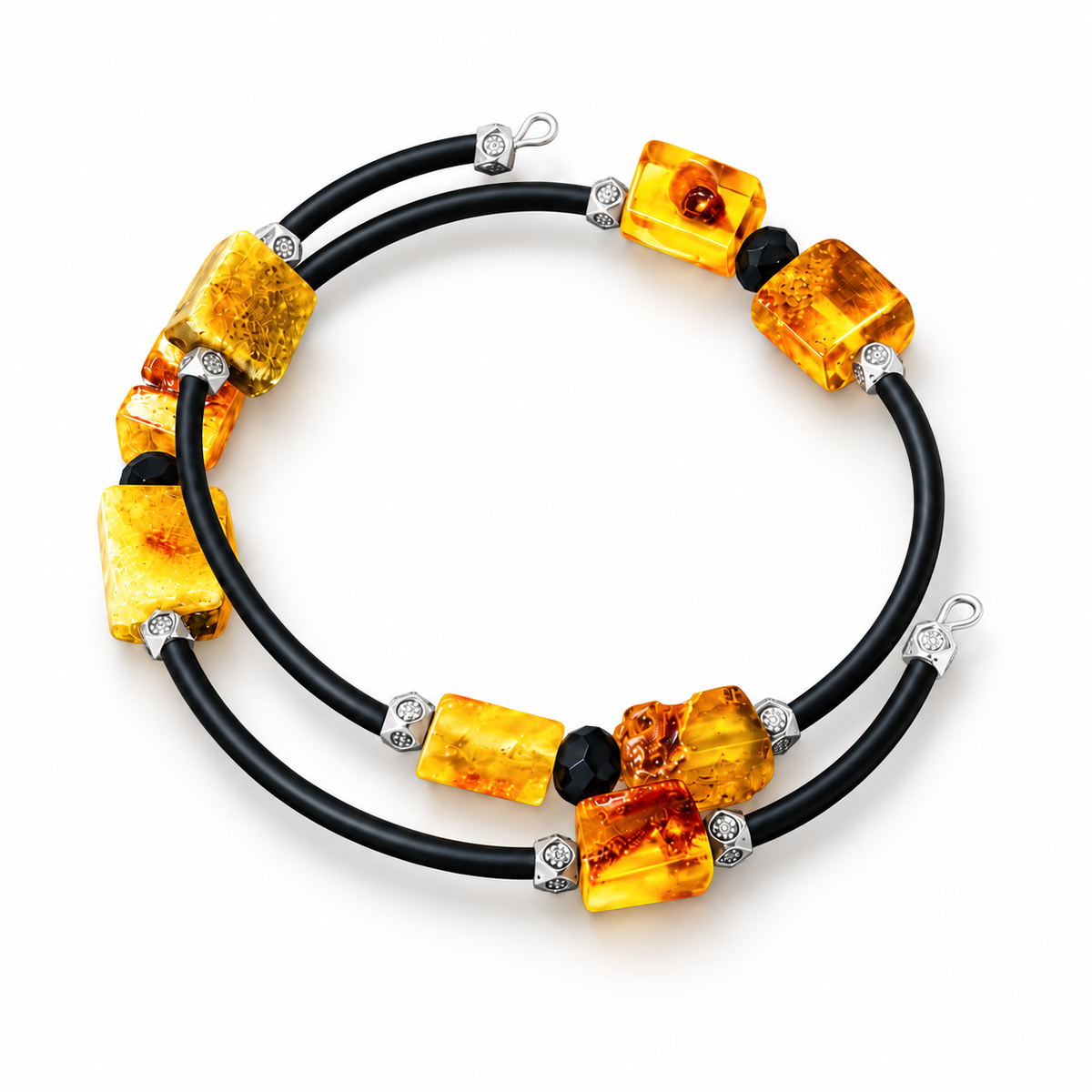 Two-turn yellow amber spiral bracelet with eight amber blocks and black separators on white