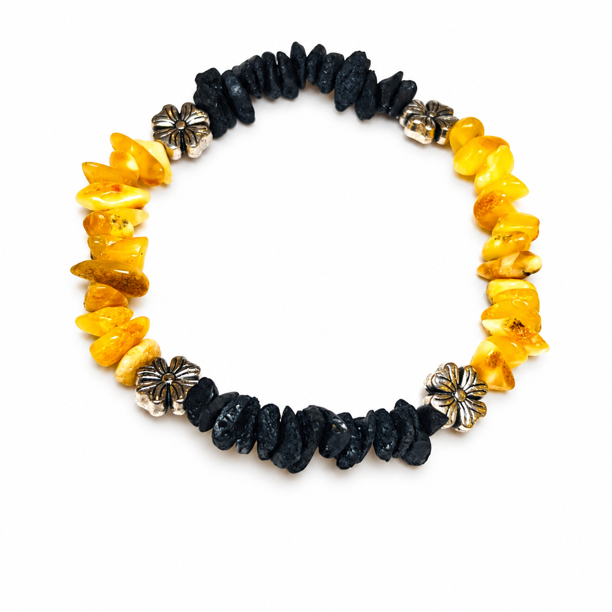 Alternating sections of yellow and black amber chips with four flower-shaped spacers on pure white.
