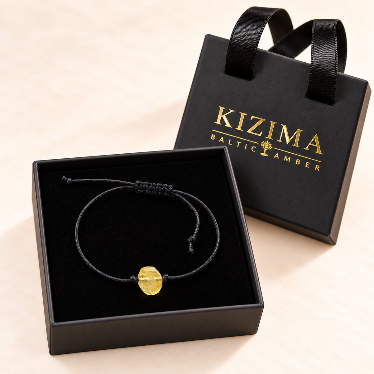 Single-stone amber cord bracelet in a KIZIMA gift box with pristine black velvet