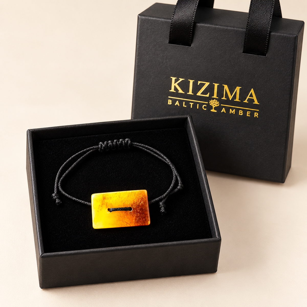 Rectangular amber cord bracelet 3G0125q1.81 presented inside the black KIZIMA gift box