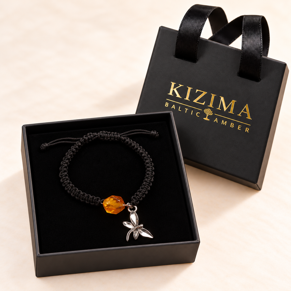 KIZIMA 3G0125q2.76-1 honey amber black macrame bracelet with silver-tone dragonfly charm in the KIZIMA black velvet gift box