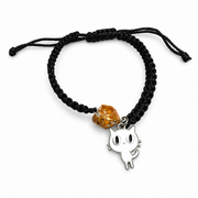 Adjustable black macrame bracelet with a cognac amber stone and white enamel cat charm against white