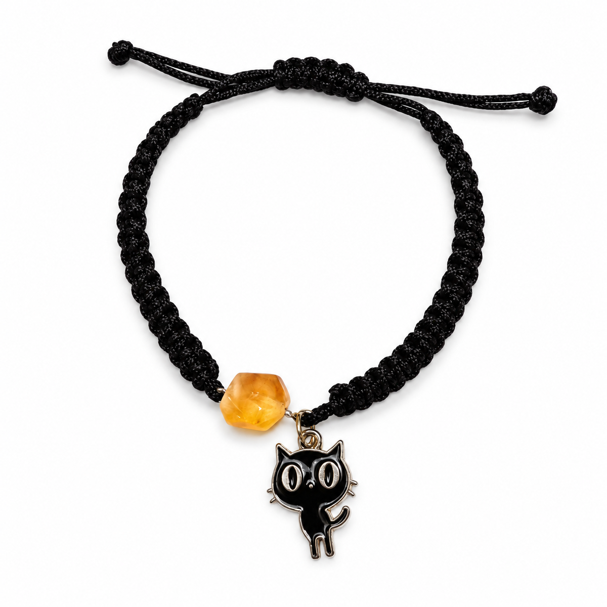 Faceted honey amber bead and black cat pendant with an adjustable black macrame band on white