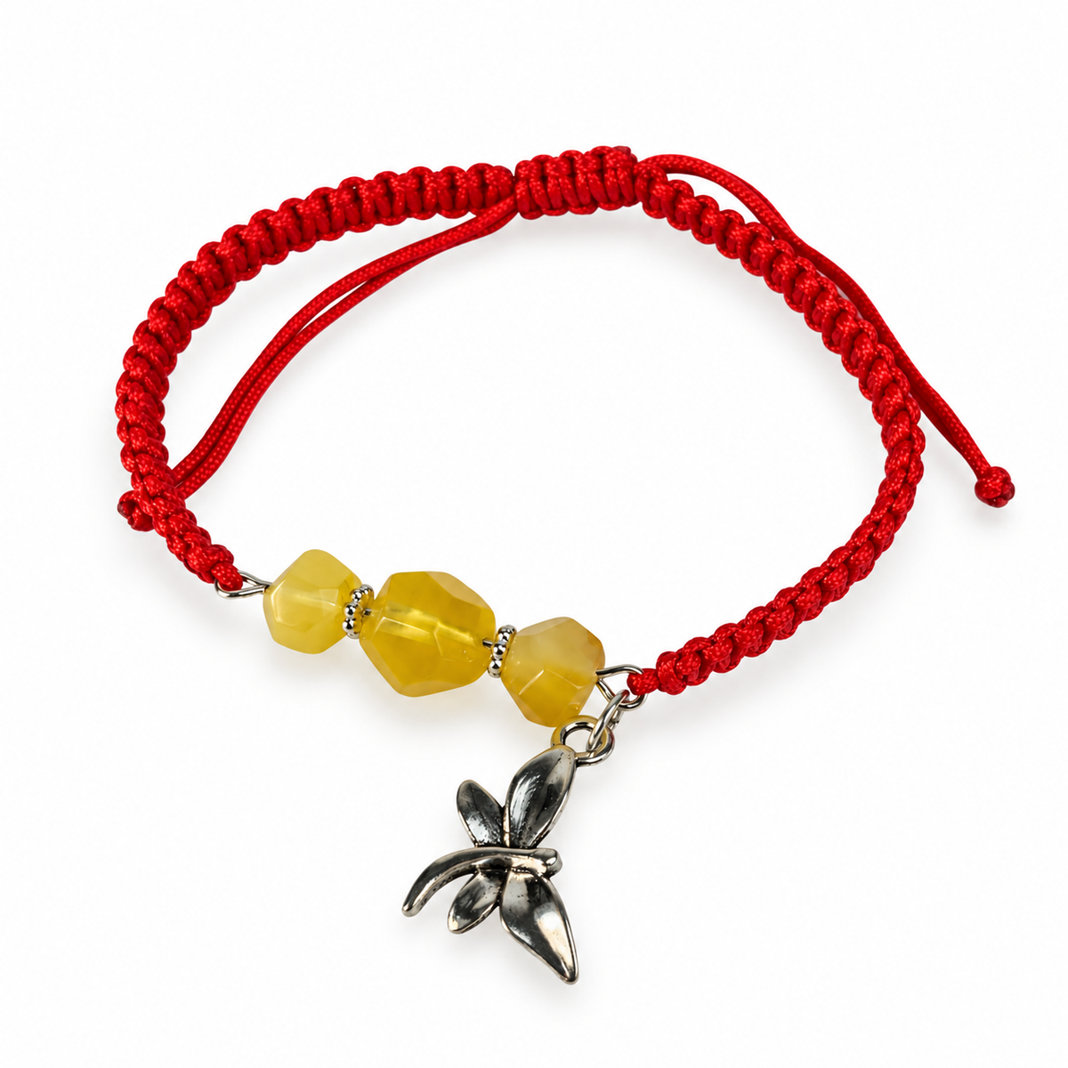 Three yellow amber beads, red adjustable macrame cord and a dragonfly charm photographed on pure white.