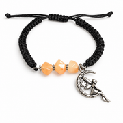 KIZIMA three peach amber stones and silver-tone moon fairy charm on black macrame bracelet against pure white