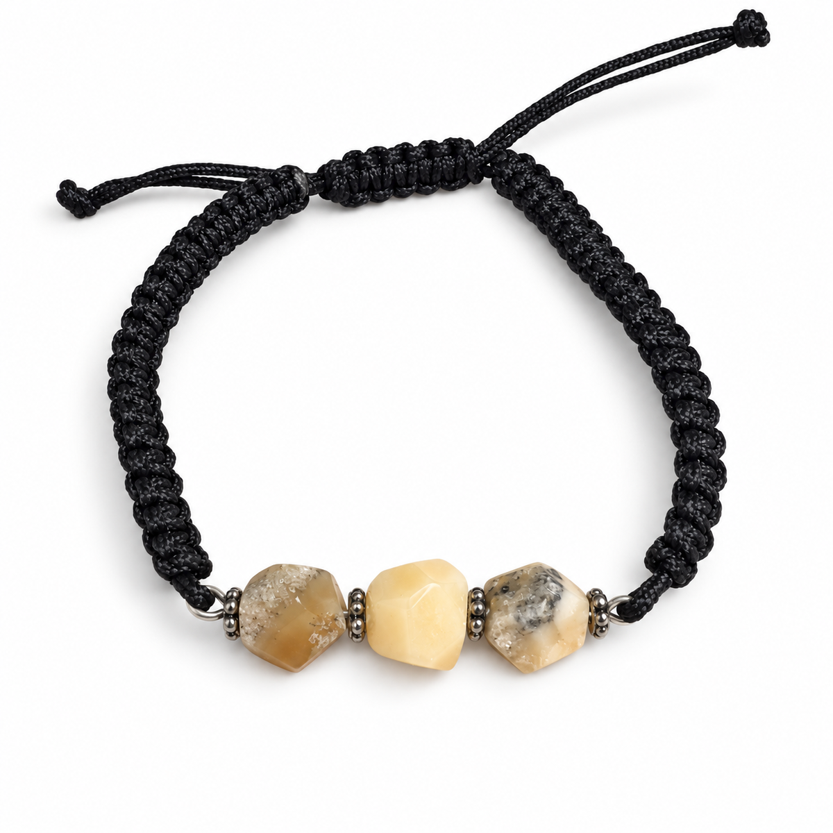 KIZIMA three-stone cream and gray-included amber bracelet on black macrame on a pure white background