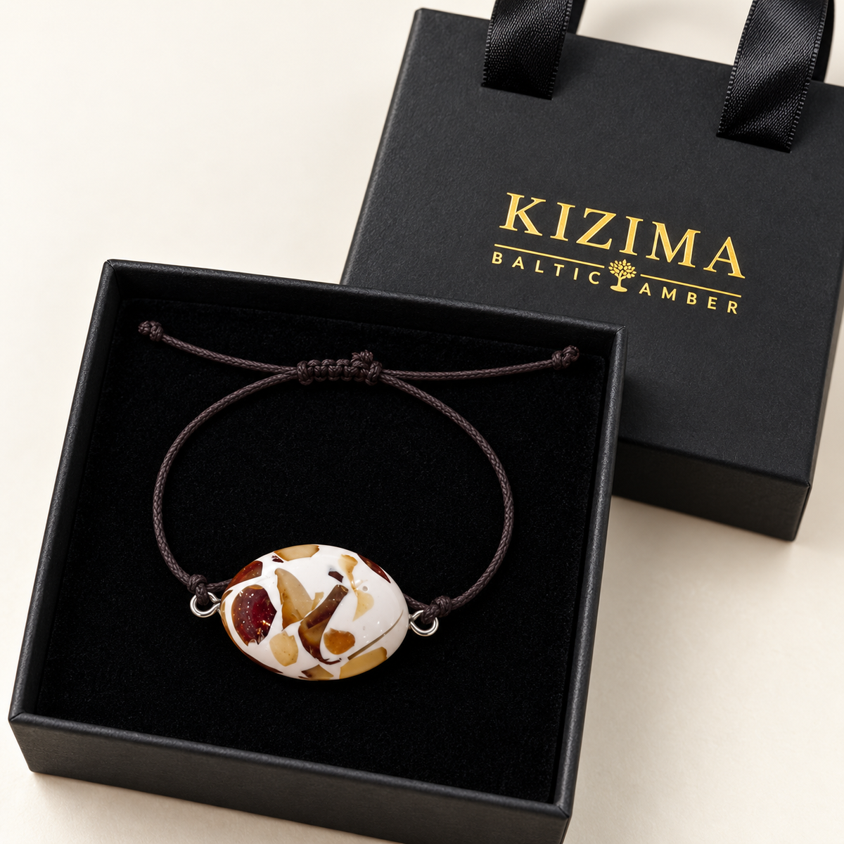 KIZIMA 3G0125q3.30 oval mosaic bracelet on clean black velvet in its branded gift box