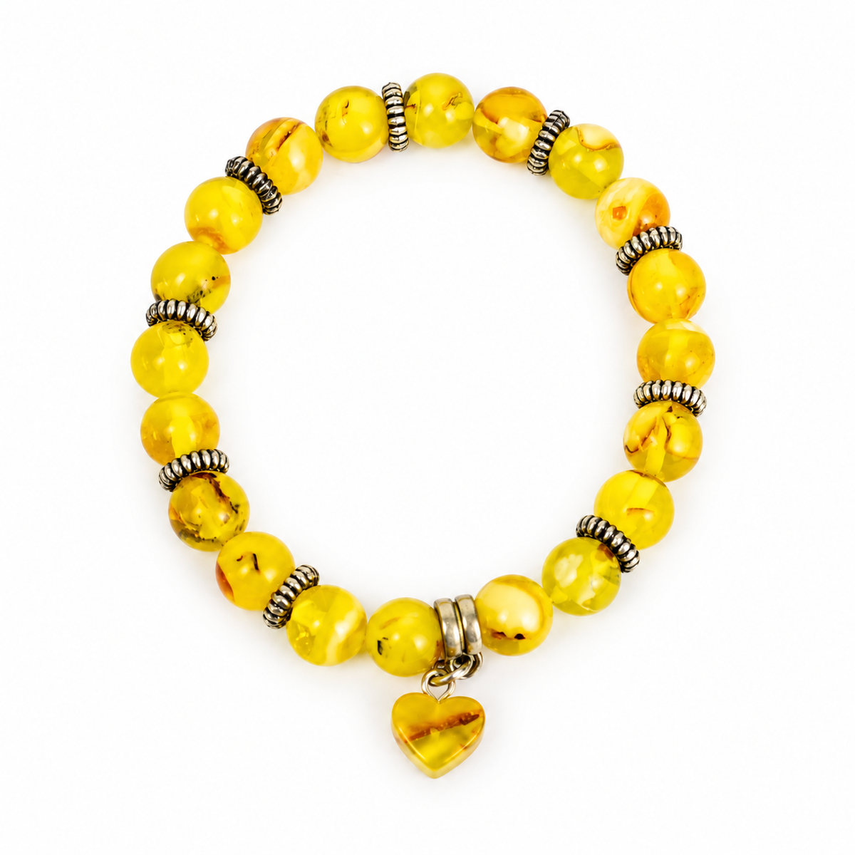 Yellow amber bracelet with twenty round beads, decorative spacers and a heart pendant on pure white.