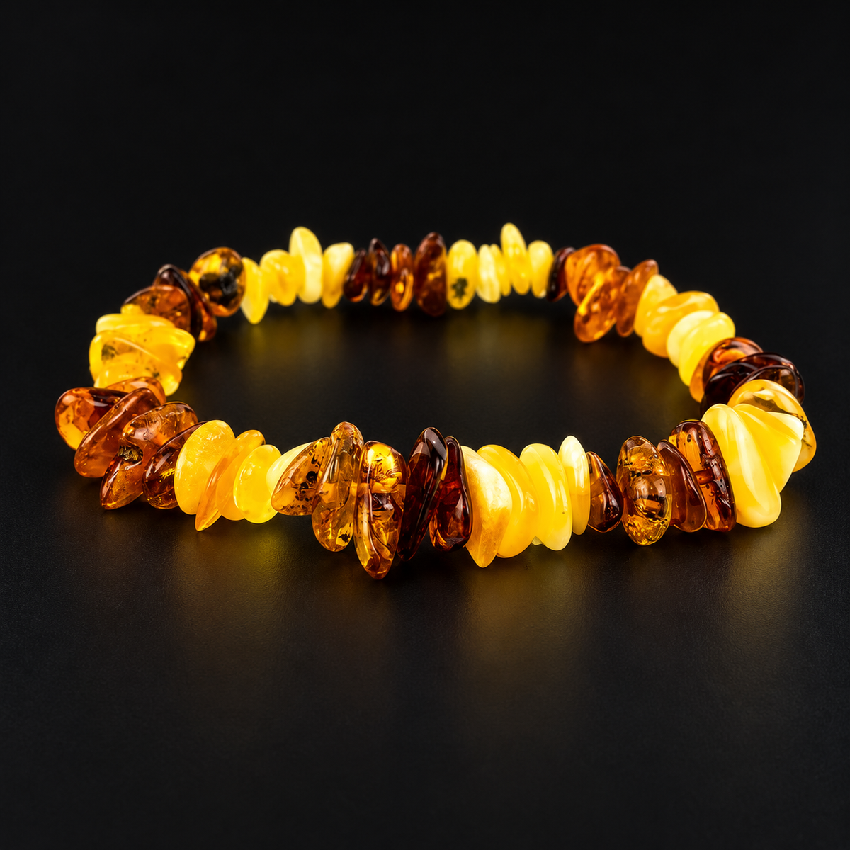KIZIMA 3K0057q4.80NR17.1 lemon-yellow and cognac amber chip elastic bracelet on a black studio background
