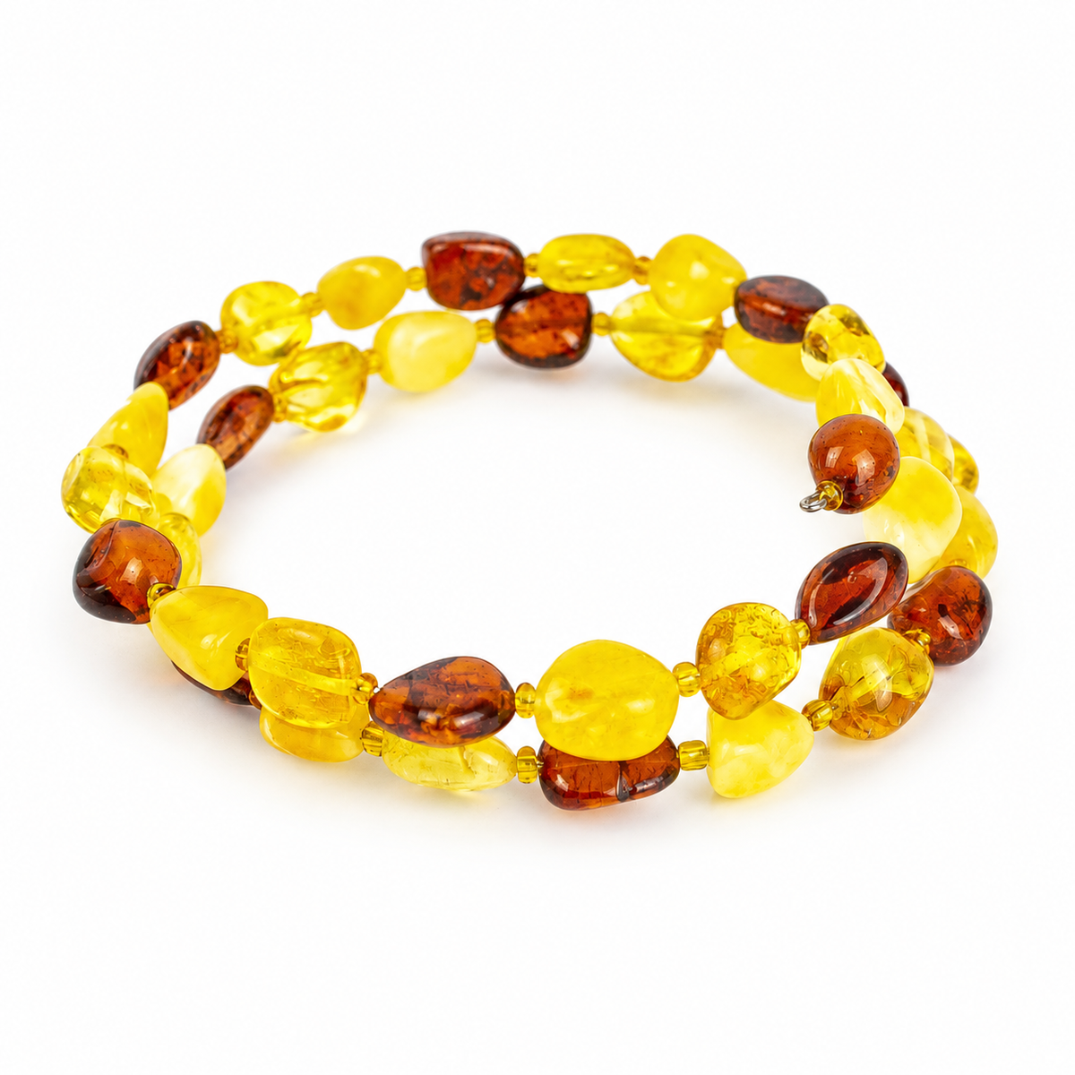 KIZIMA two-turn yellow and cognac amber pebble spiral bracelet against a pure white background