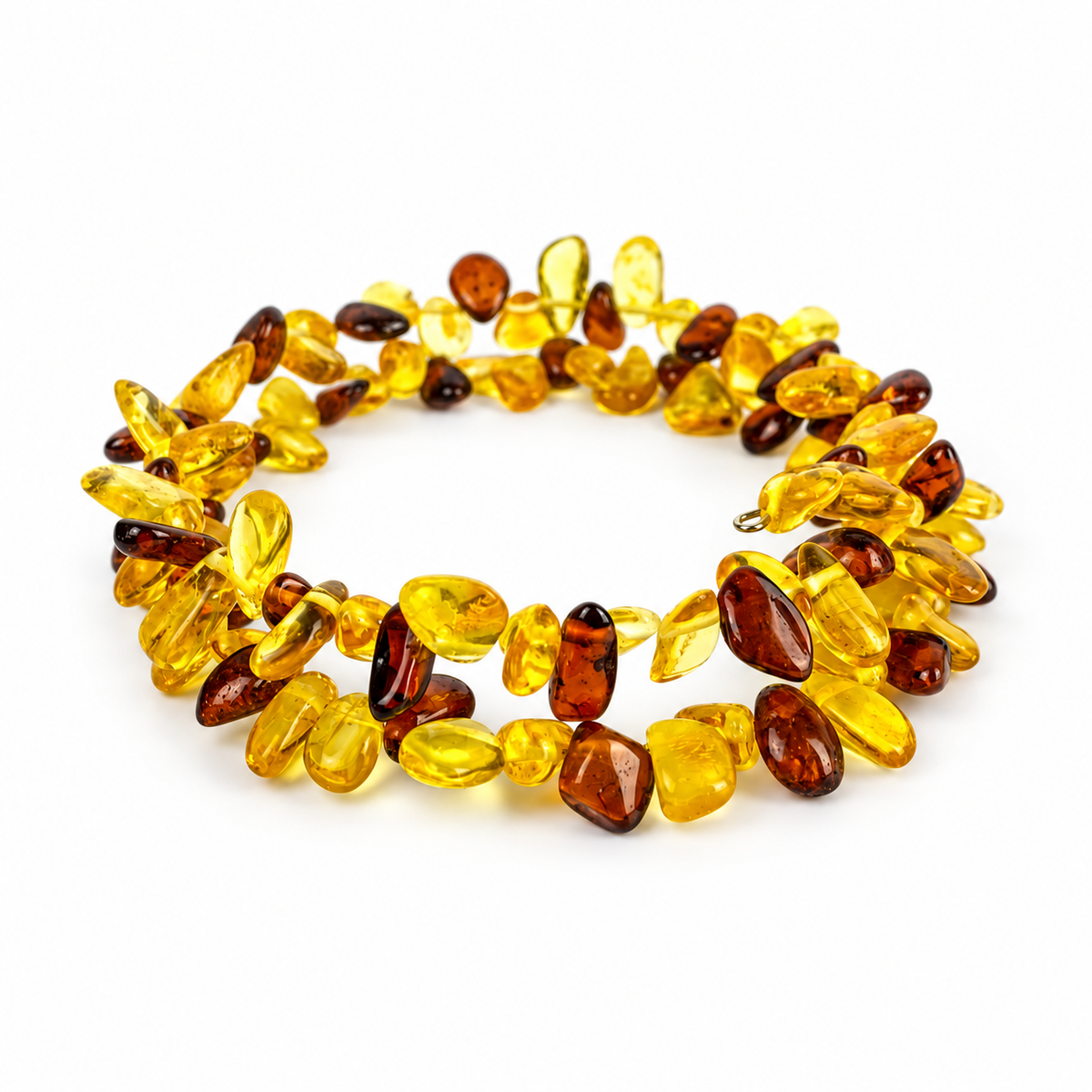 Natural yellow and cognac amber chip spiral bracelet, with its looped wire ends, on white.