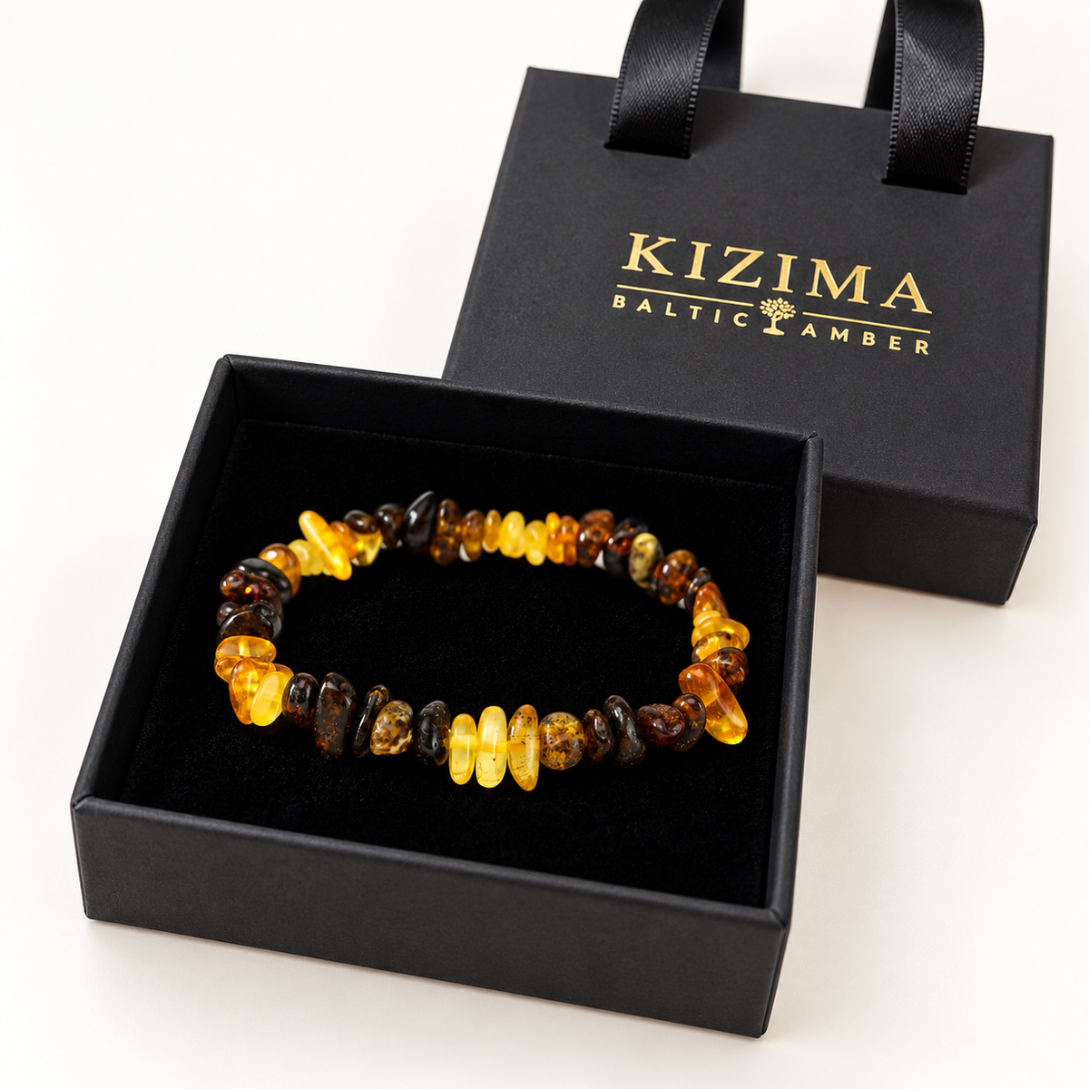 KIZIMA yellow and dark mottled amber nugget bracelet in a KIZIMA gift box.