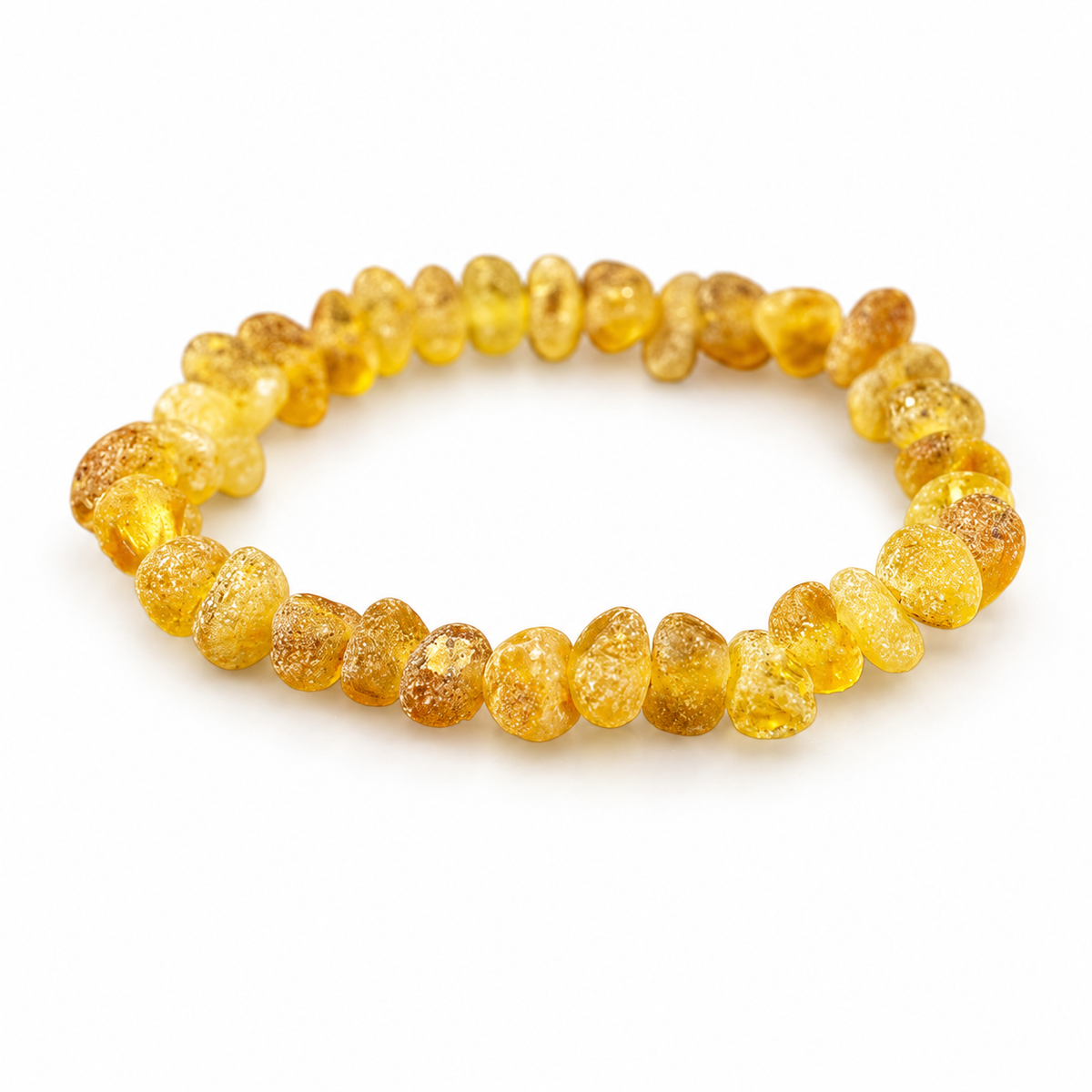 Irregular raw yellow amber nugget bracelet with natural granular surfaces on pure white.