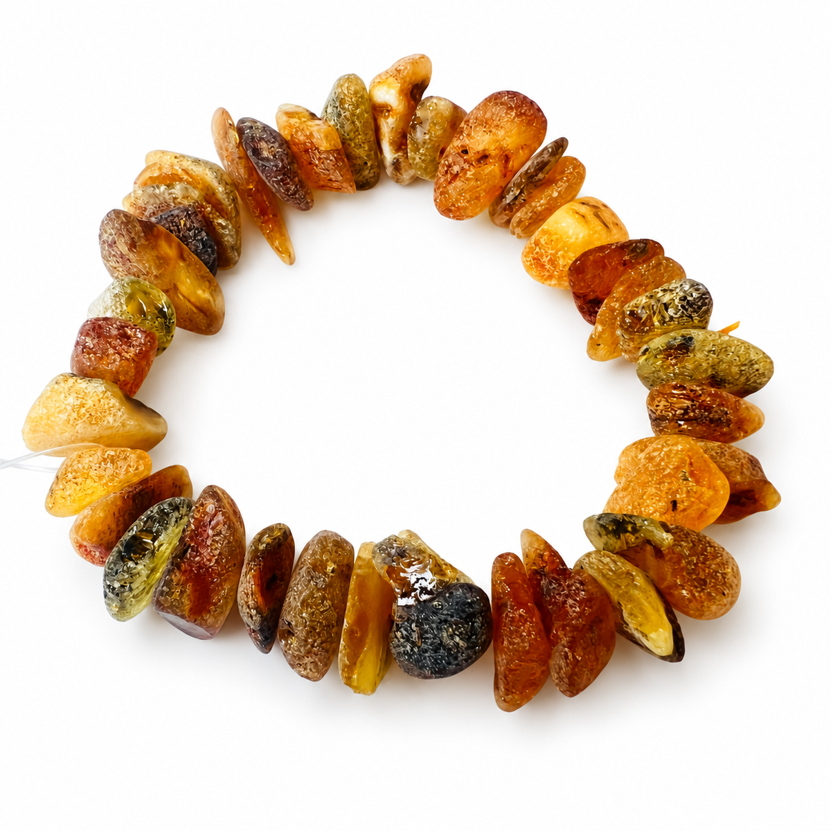 KIZIMA 3N0150q17.16 natural amber chip bracelet with varied honey and mottled tones isolated against pure white