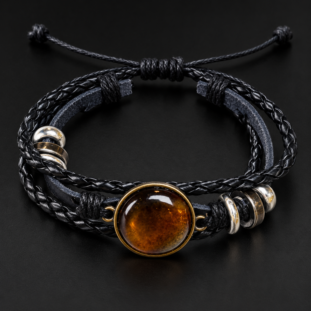 KIZIMA 3N0180q8.4 round cognac amber cabochon multi-strand black leather bracelet on a black studio background