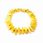 KIZIMA 3N0200q11.50 yellow amber chip bracelet with reddish-brown spacers isolated against pure white