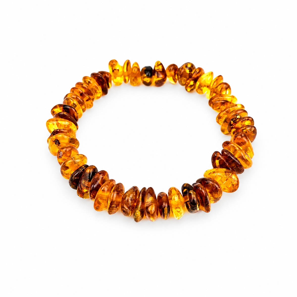 Irregular transparent amber chip beads arranged as a continuous stretch bracelet on white