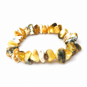 KIZIMA 3N0200q17.85 cream and mottled amber chip bracelet isolated against pure white