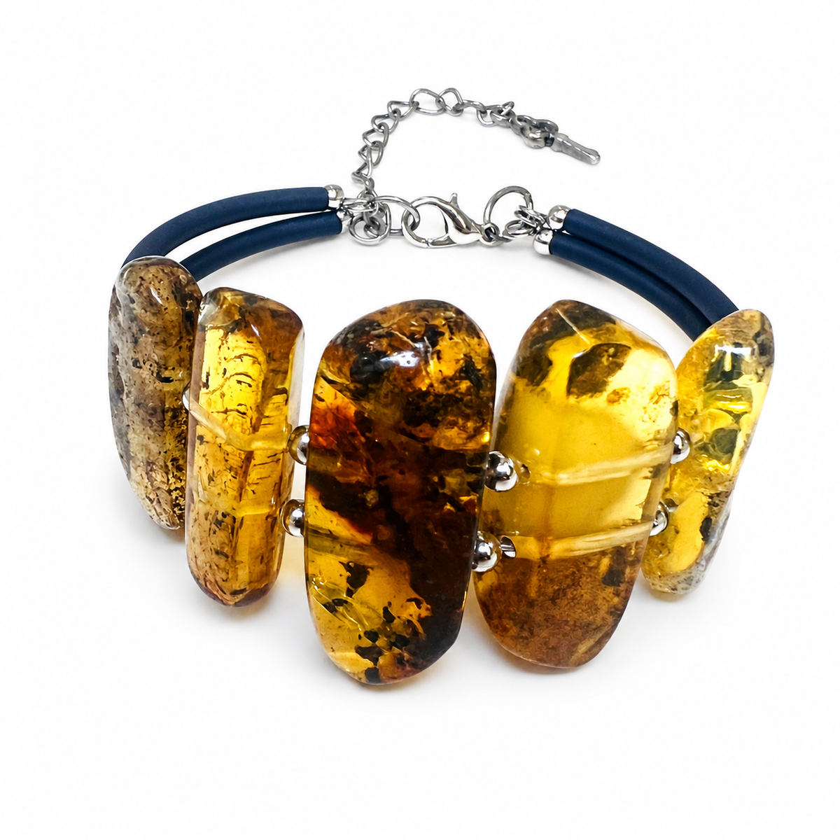 KIZIMA 3N0350q12 amber slab bracelet showing twin navy cords and silver-tone fittings against pure white