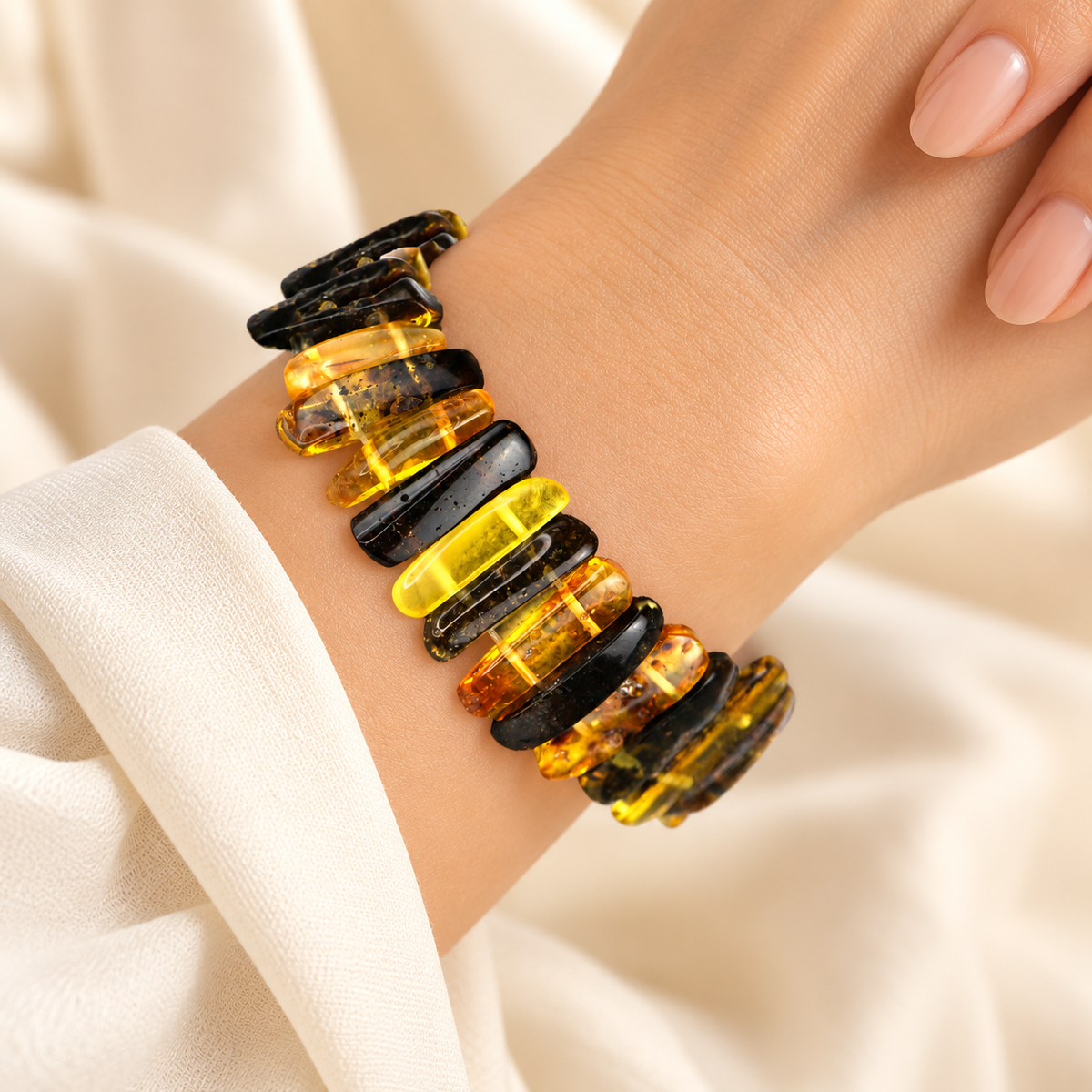 Alternating yellow and dark amber bar bracelet on a young adult woman's graceful wrist.