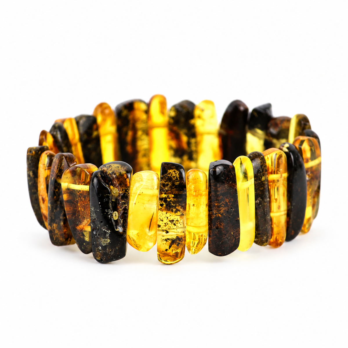 Tall polished honey and dark mottled amber bars with two elastic cords on pure white.