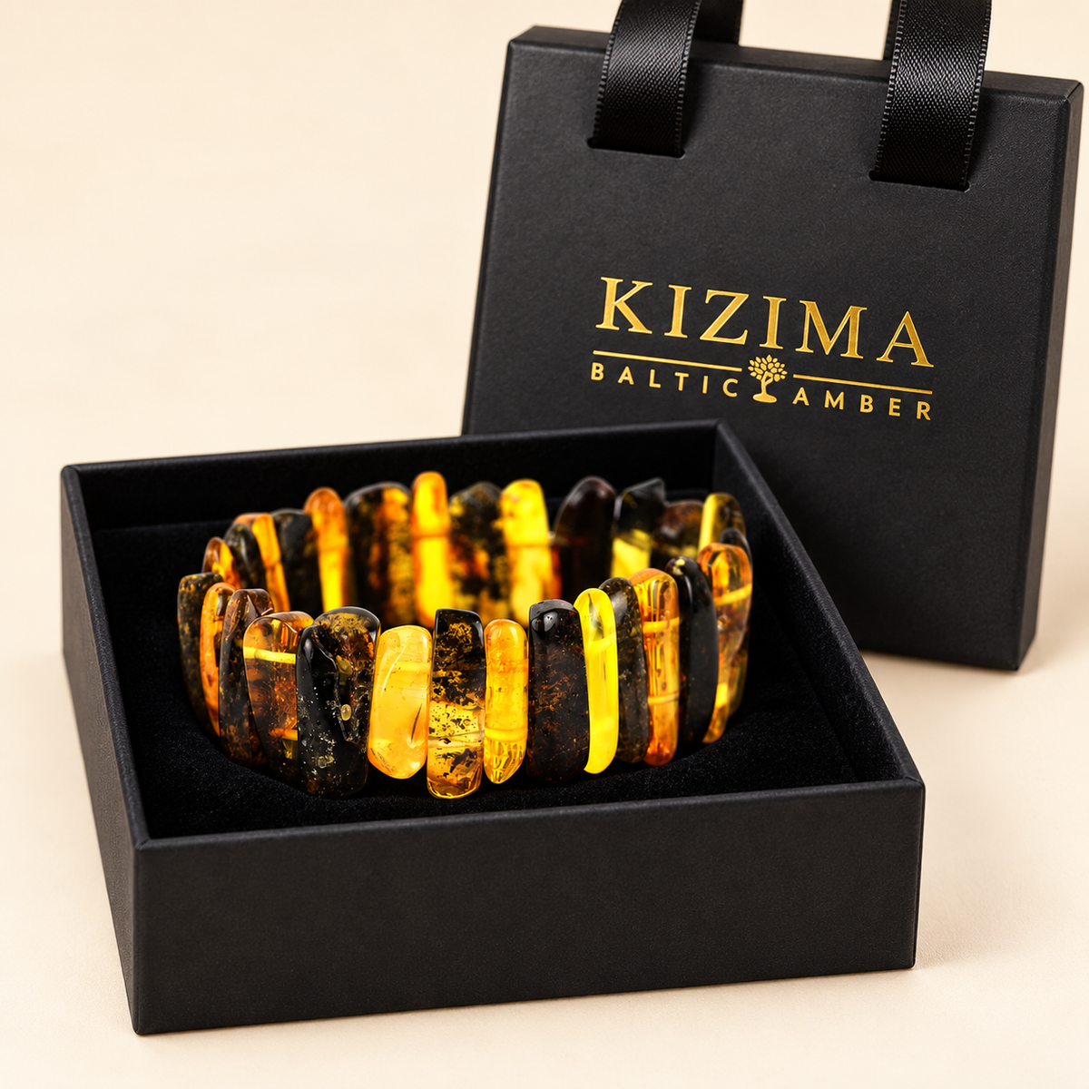 Honey and dark amber bar bracelet on spotless black velvet in its KIZIMA gift box.