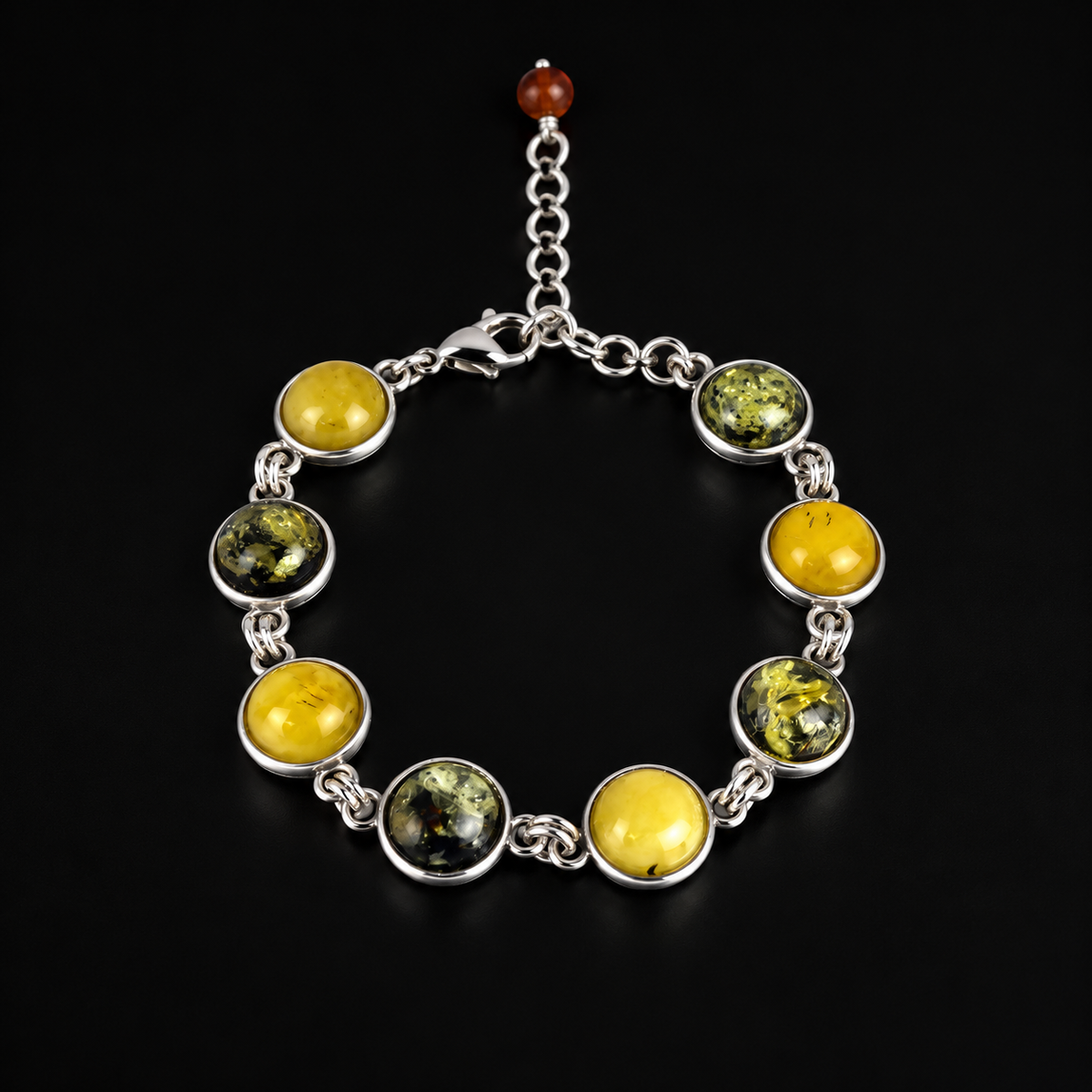 KIZIMA 3N0900q12-1.1 bracelet with eight alternating yellow and green amber cabochons on a black studio surface