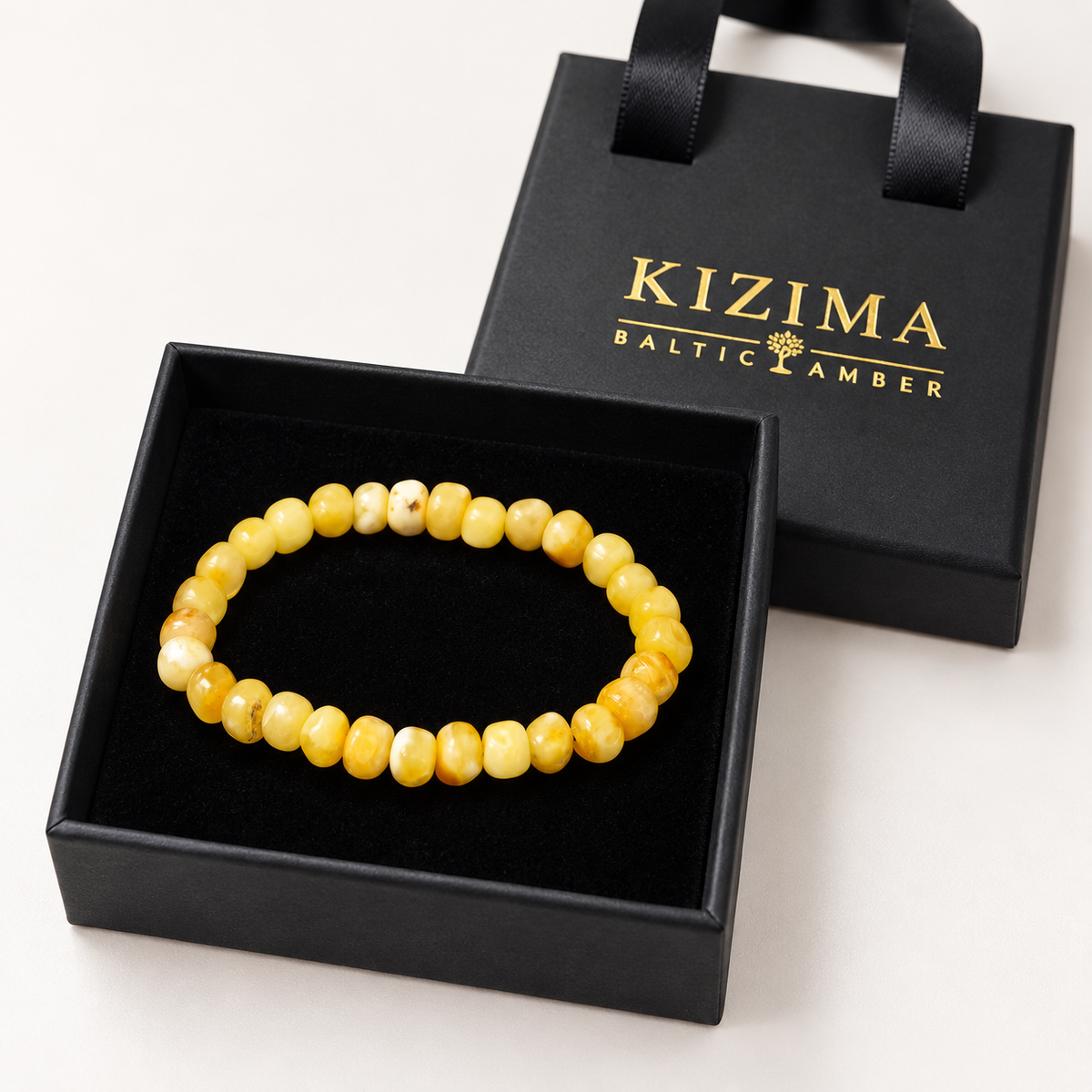 KIZIMA creamy yellow amber rounded nugget bracelet in a KIZIMA gift box.