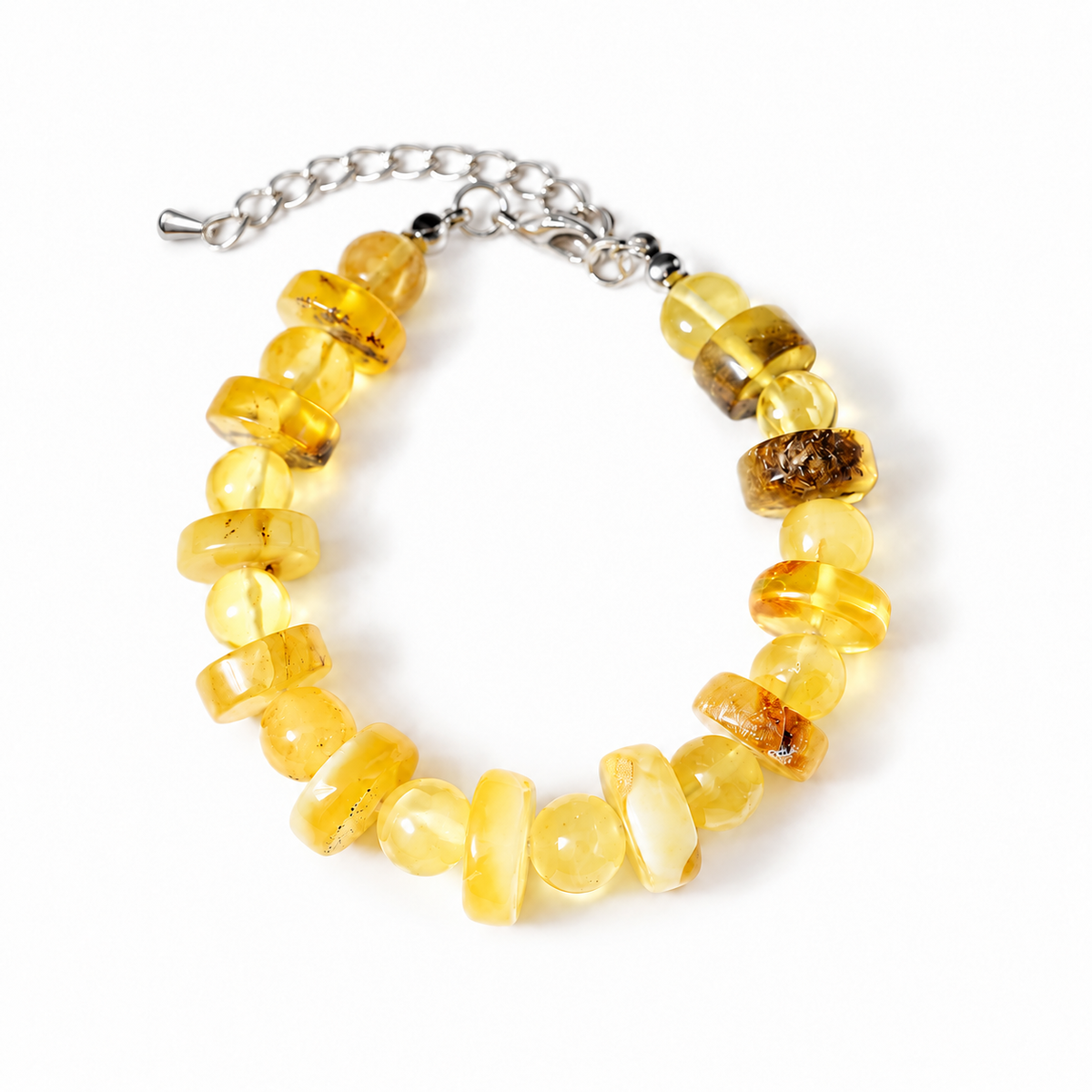Cream, yellow and honey amber clasp bracelet with extender chain on pure white.