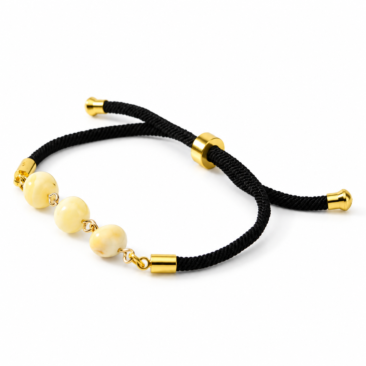 Adjustable black cord bracelet 3P0350q4.11 with three pale amber beads isolated on white