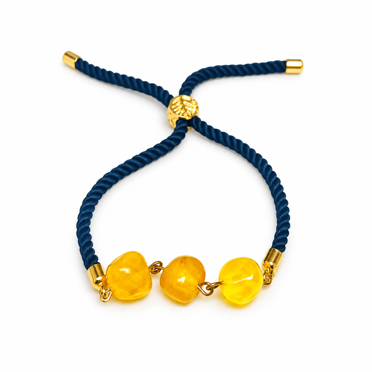 KIZIMA 3P0500q5.73 bracelet with three yellow amber beads and navy cord isolated on pure white