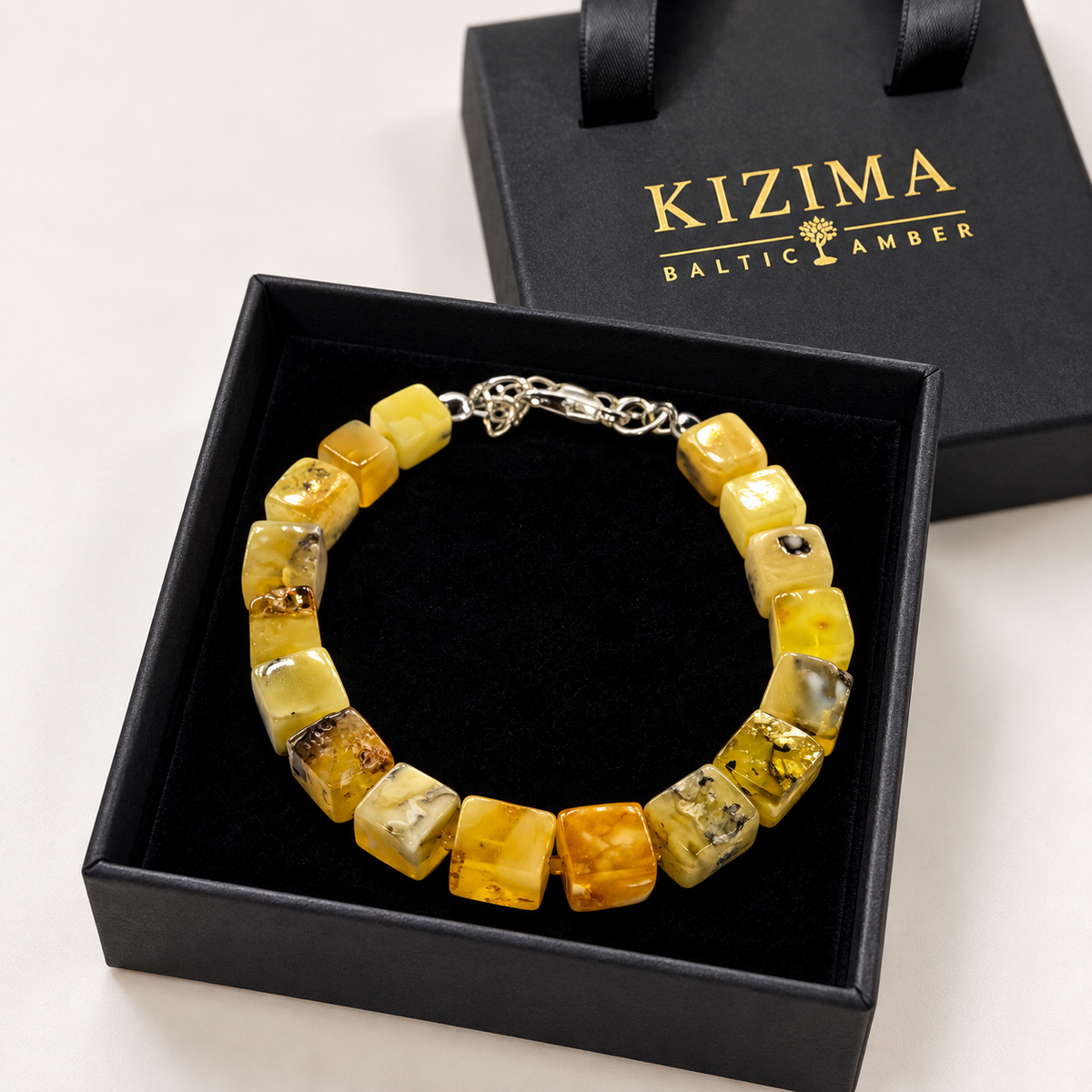 KIZIMA yellow amber cuboid bead bracelet with silver-tone clasp in a KIZIMA gift box.