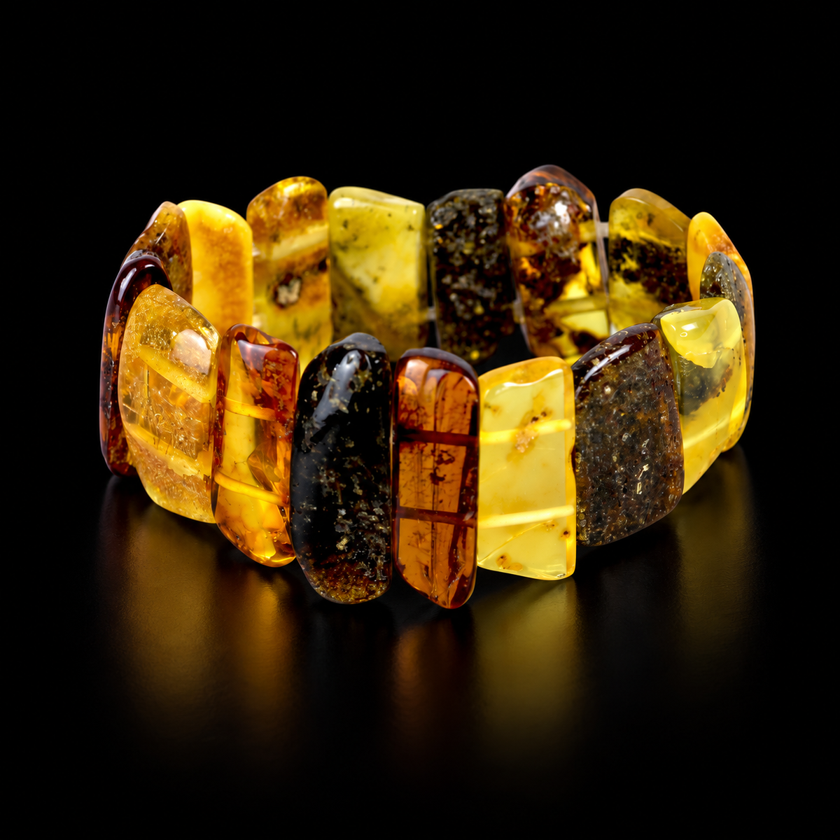 Wide multicolor amber panel bracelet by KIZIMA under soft black studio lighting.