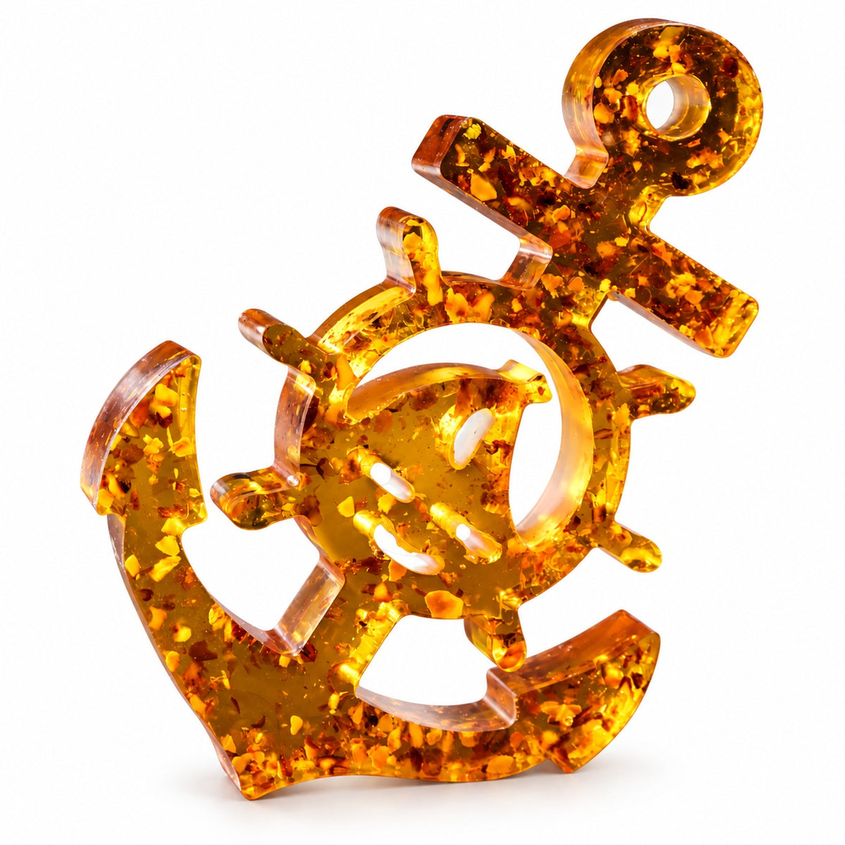 KIZIMA honey-gold Baltic amber anchor and ship wheel sculpture on a white background.
