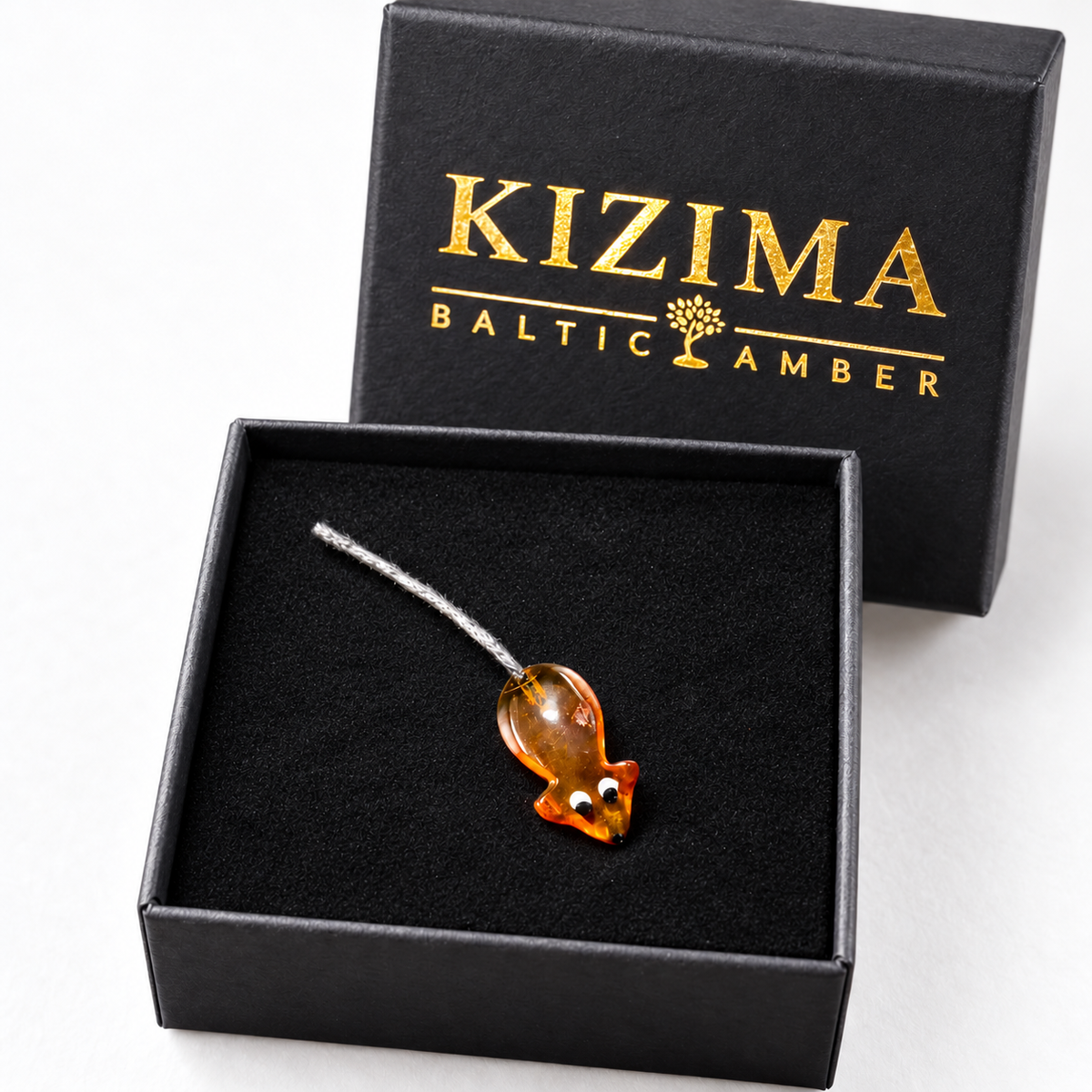 Made in USA Natural Baltic Amber money mouse amulet by KIZIMA® on black velour in the KIZIMA® Baltic Amber gift box