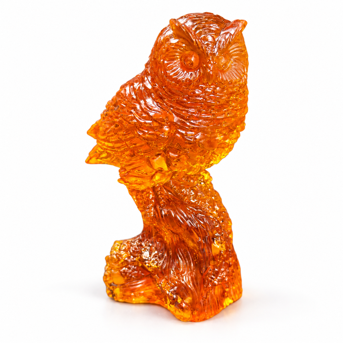 Translucent orange owl sculpture in front three-quarter view on a white studio background