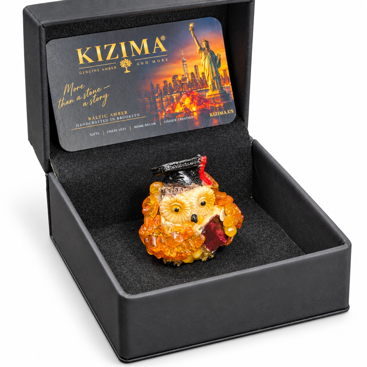 Graduation owl in its open black KIZIMA presentation box on white