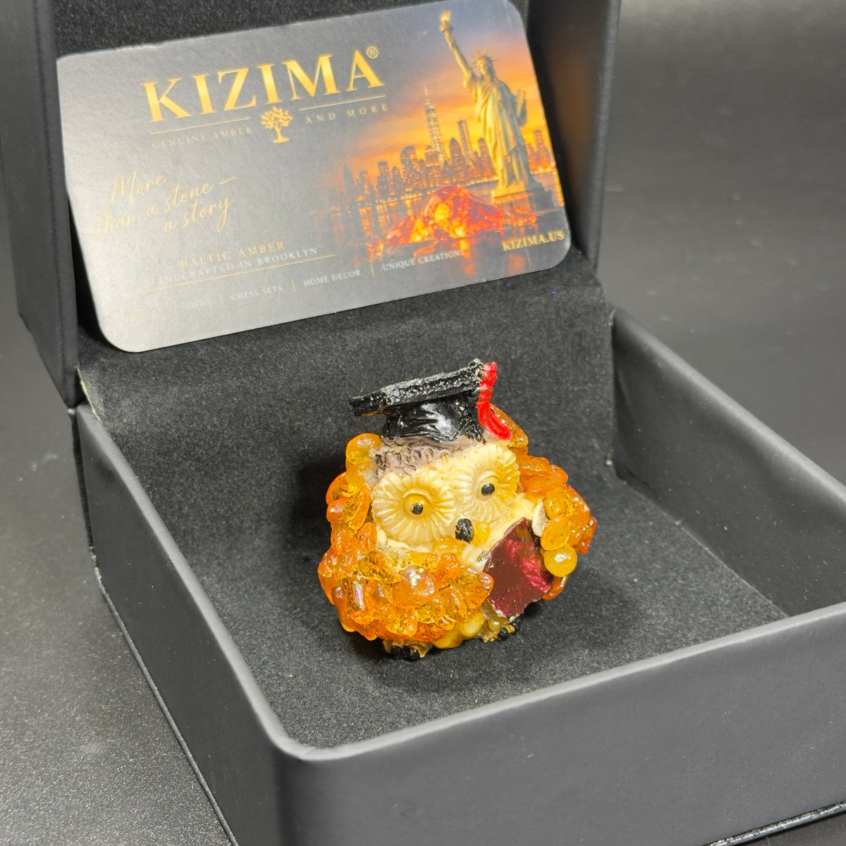Original photograph of graduation owl inside its black KIZIMA box
