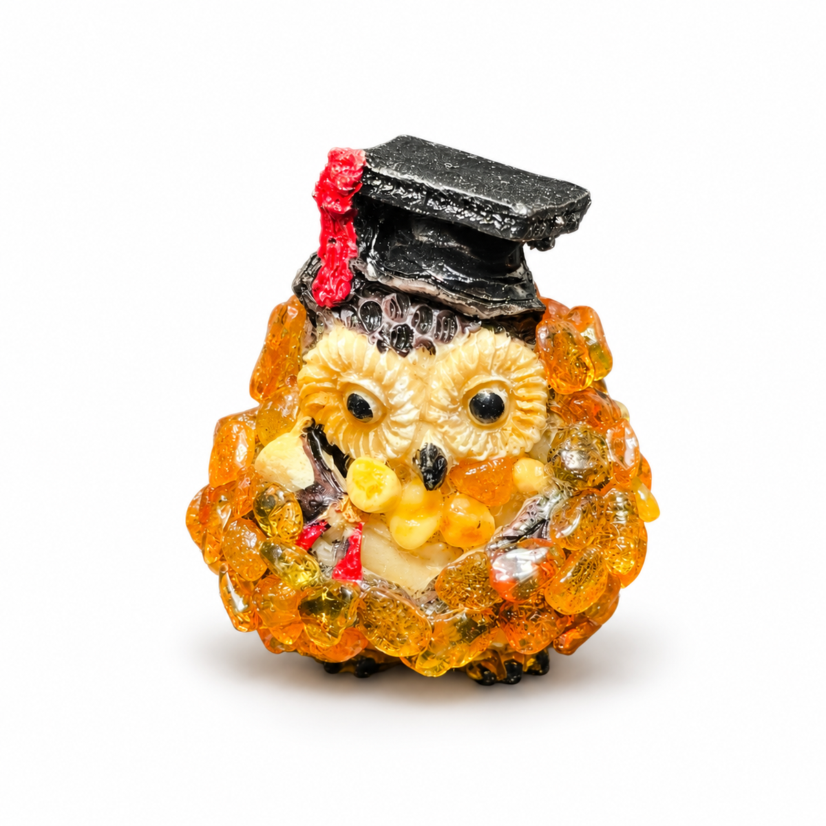 Front view of graduation owl figurine on white background