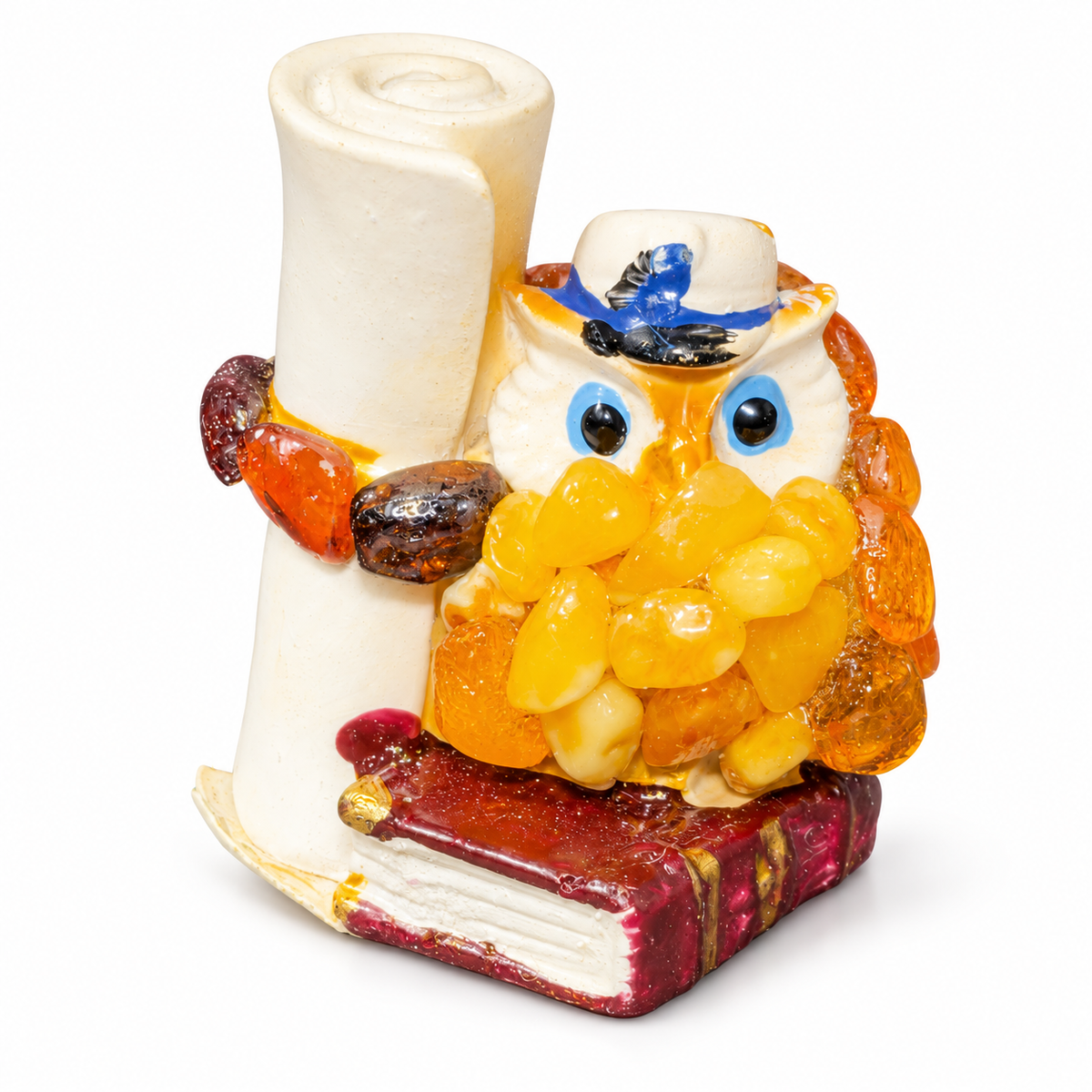 Yellow and orange owl with cream scroll and book on white studio background