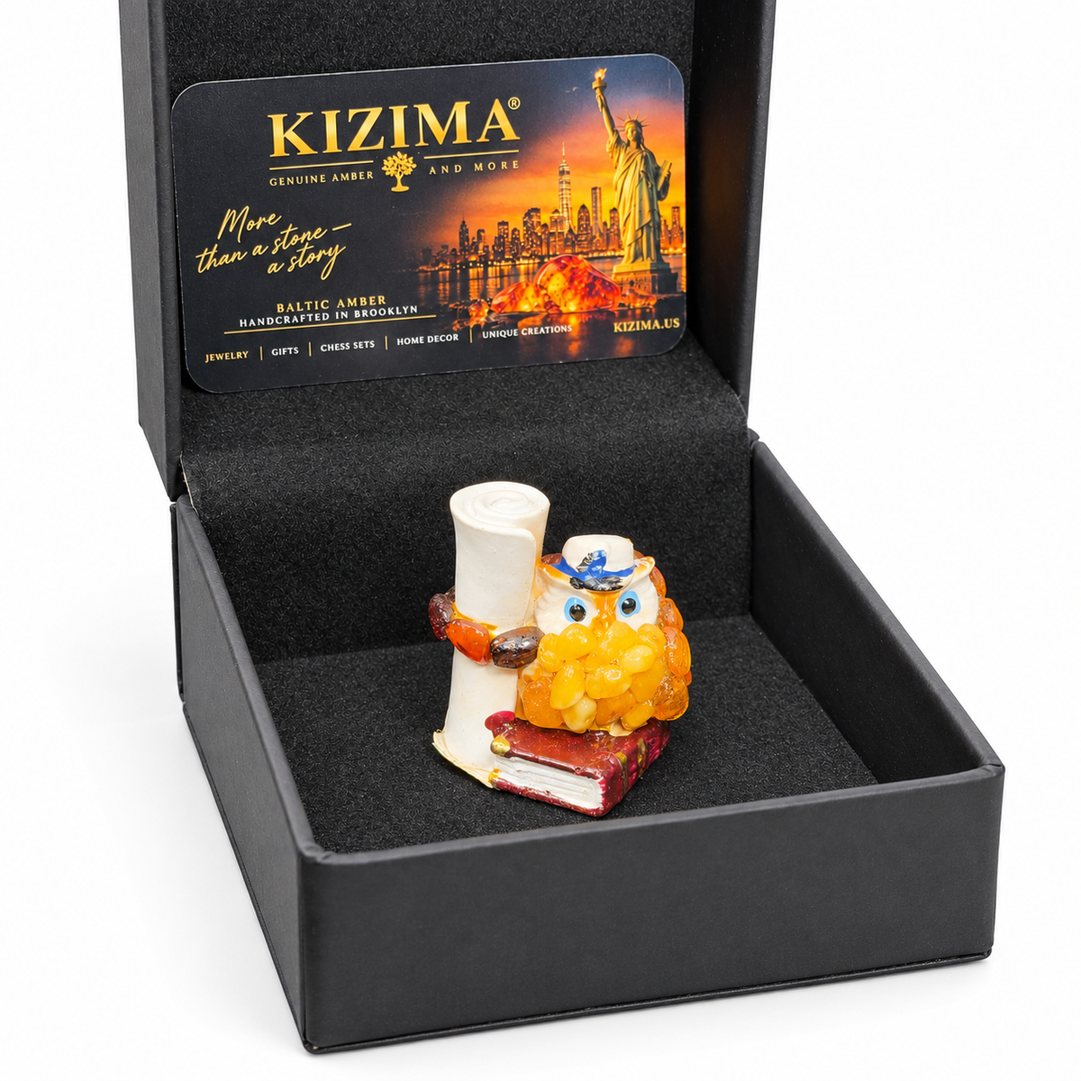 Owl figurine in its black KIZIMA presentation box on white