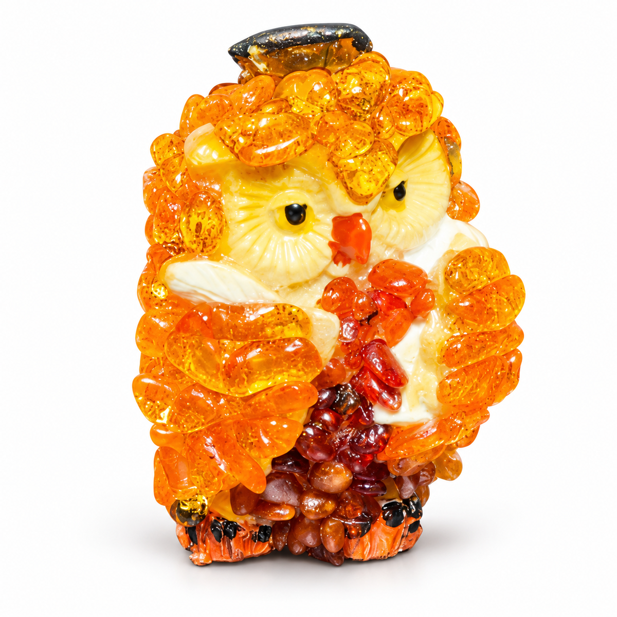 Owl figurine with textured orange wings and brown lower body on white background