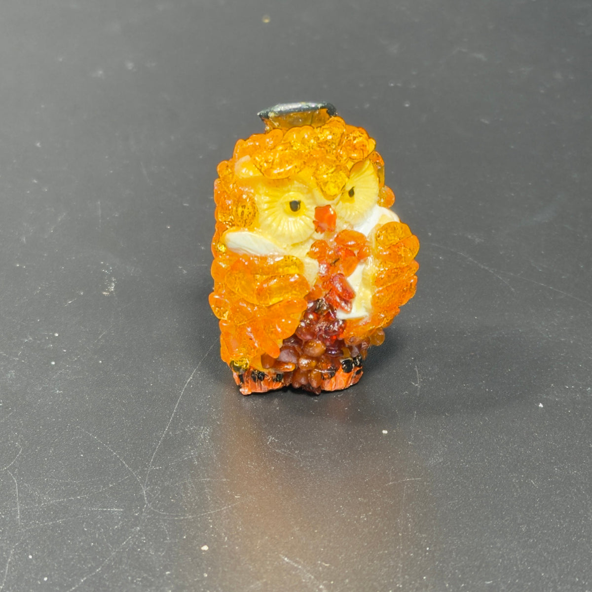 Original photograph of the golden-orange owl figurine