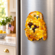 Made in USA natural Baltic amber owl refrigerator magnet on a refrigerator door.
