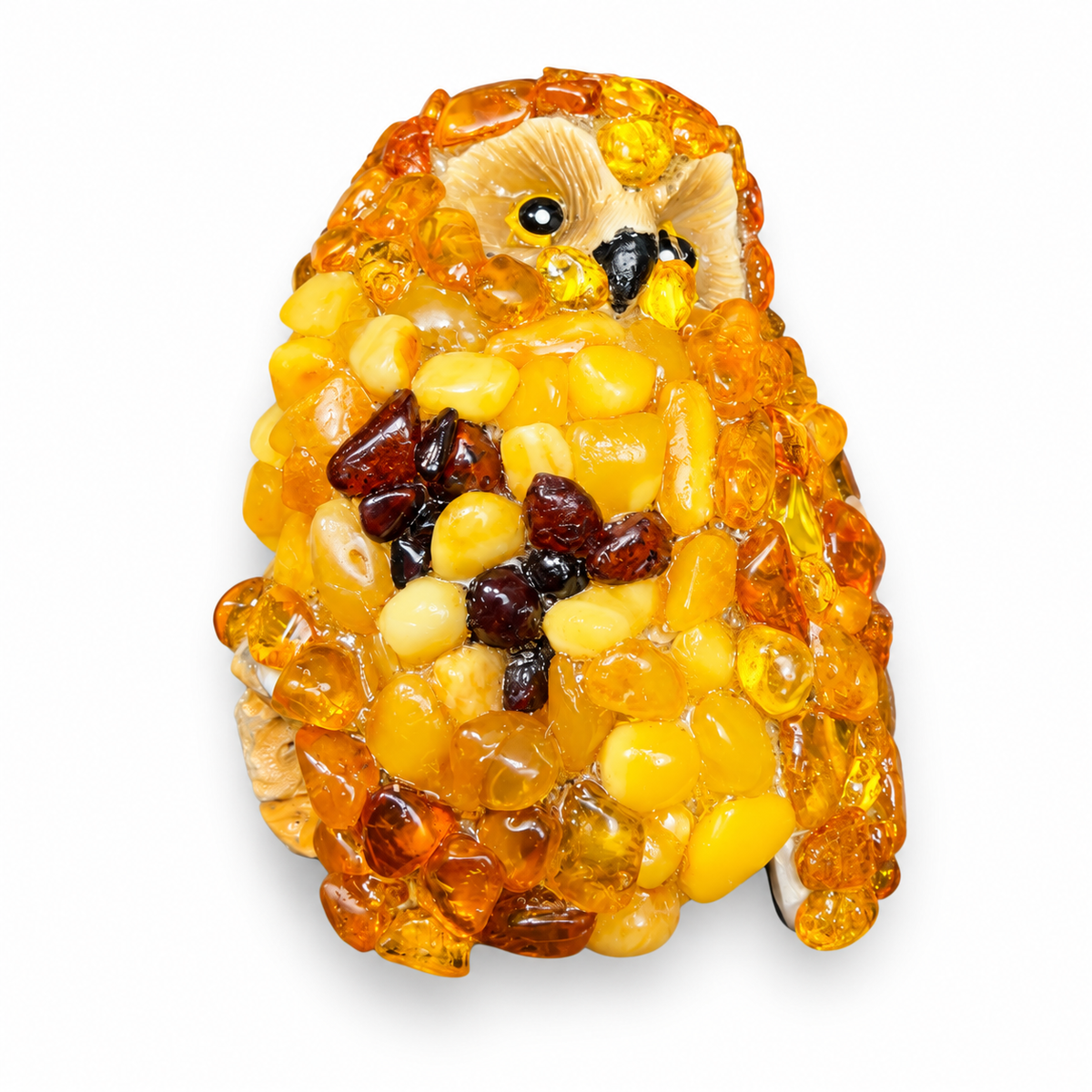 Handmade amber owl refrigerator magnet on a white background.