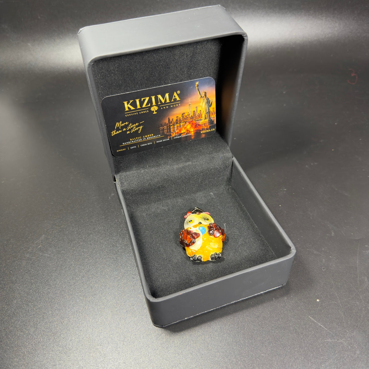 Original photograph of the graduation owl magnet inside its KIZIMA gift box